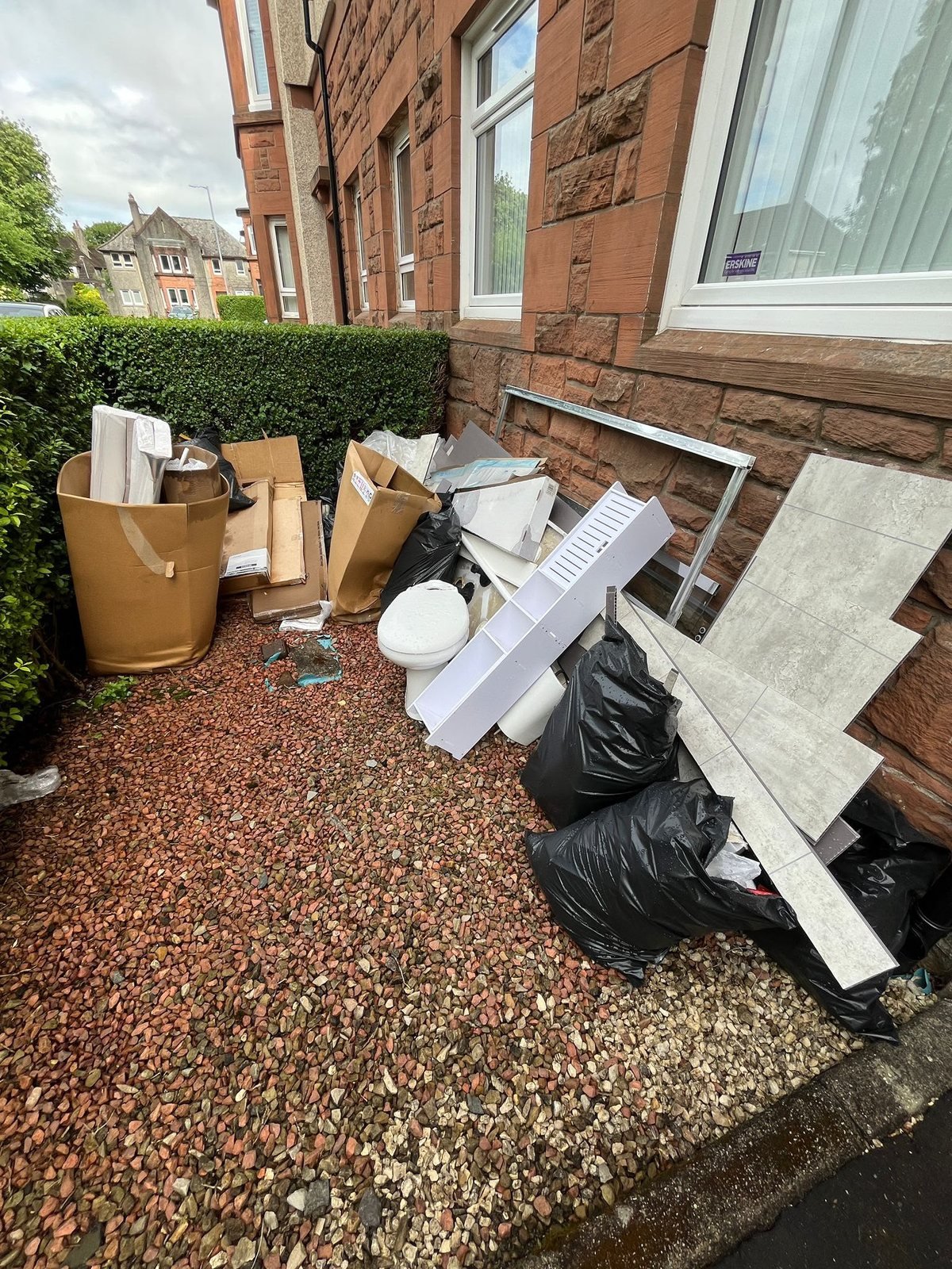 Household rubbish and fittings cleared from a Glasgow tenement