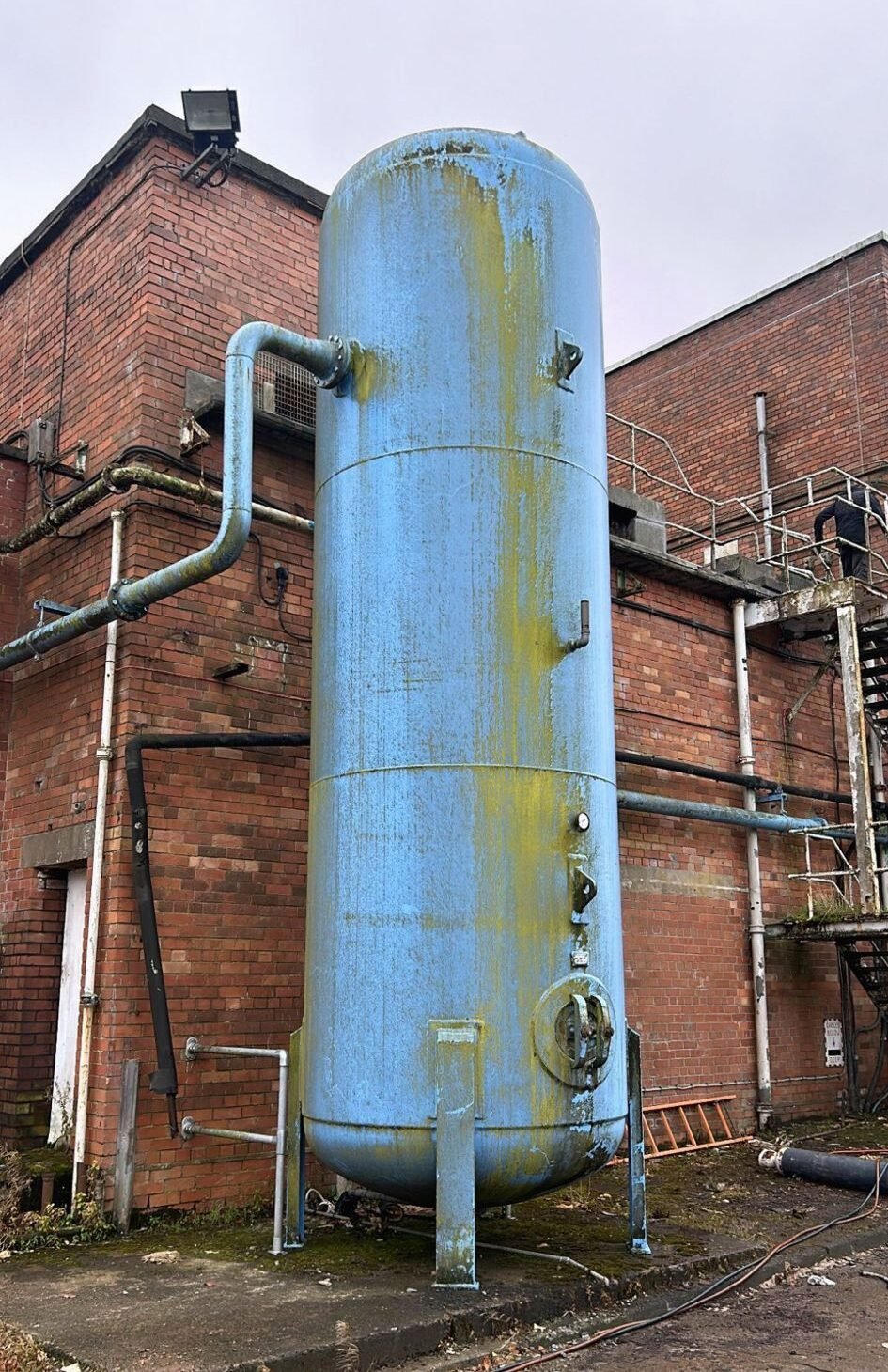 A metal tank and pipework ready for dismantling