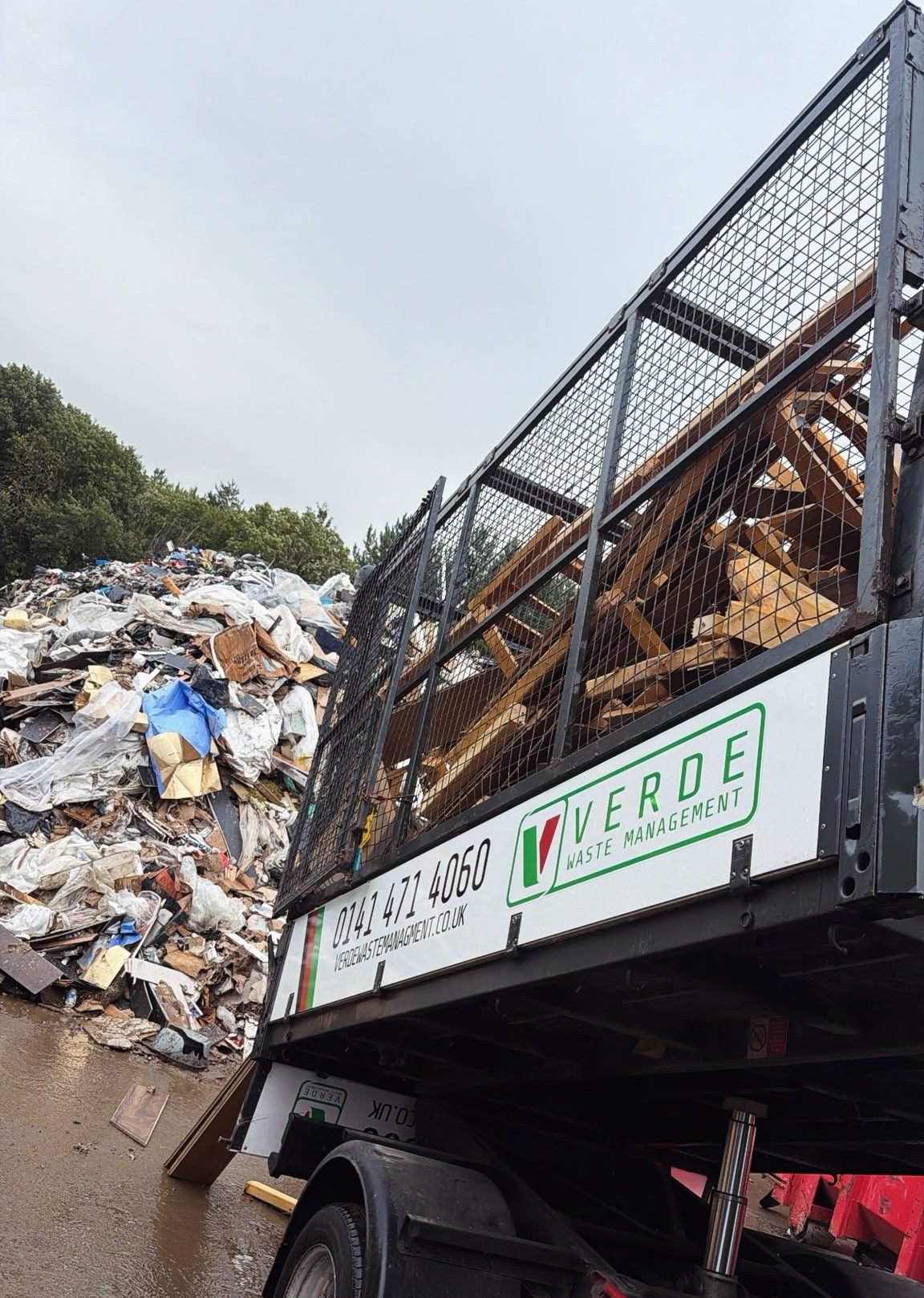 Verde cage tipper full of timber at the waste transfer site